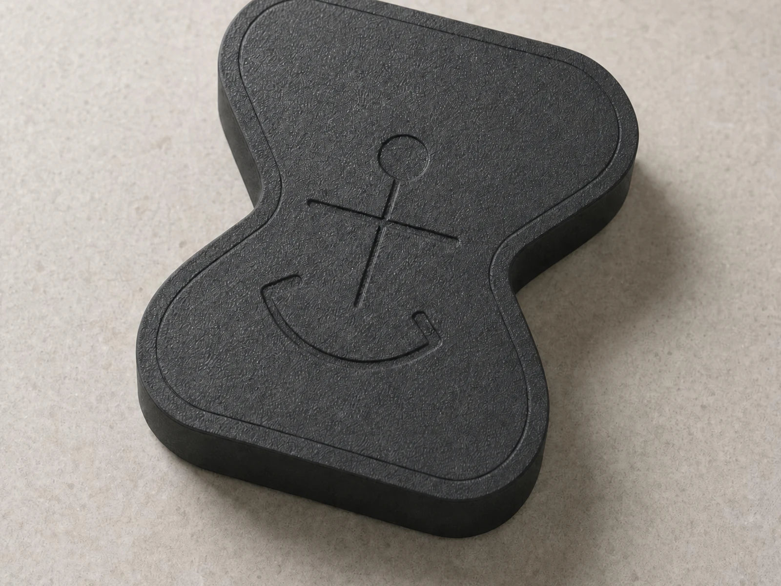 Close-up detail of the matte-black Anchor physical app blocker