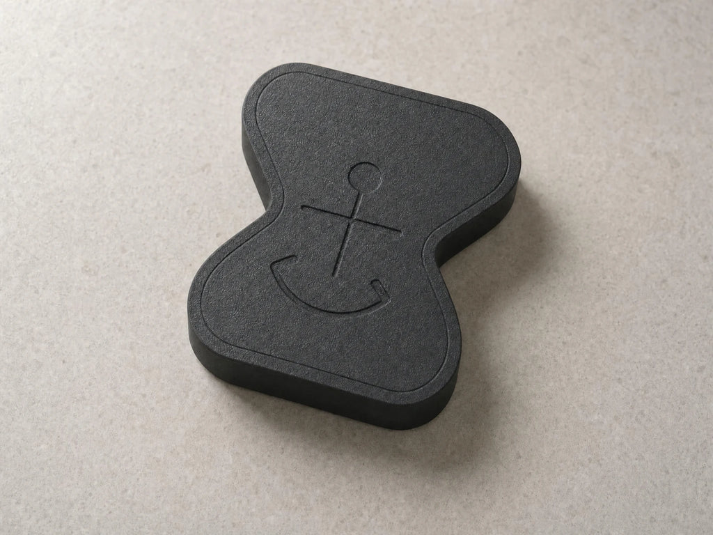 Matte-black Anchor physical app blocker, shown at a three-quarter angle